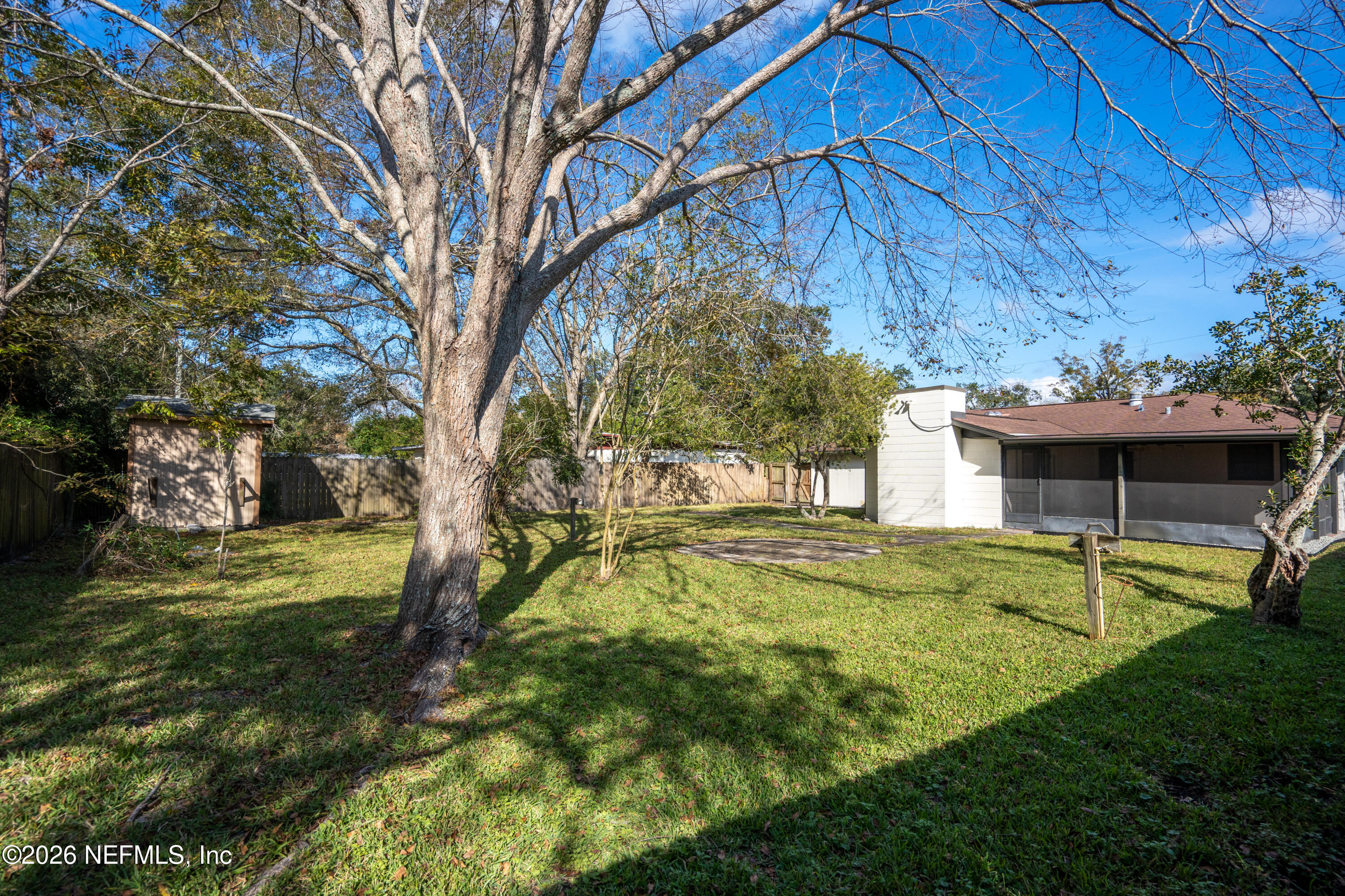 1241 Hibiscus Street St. Augustine, FL 32084 - Photo 25 of 27 a view of a house with a backyard