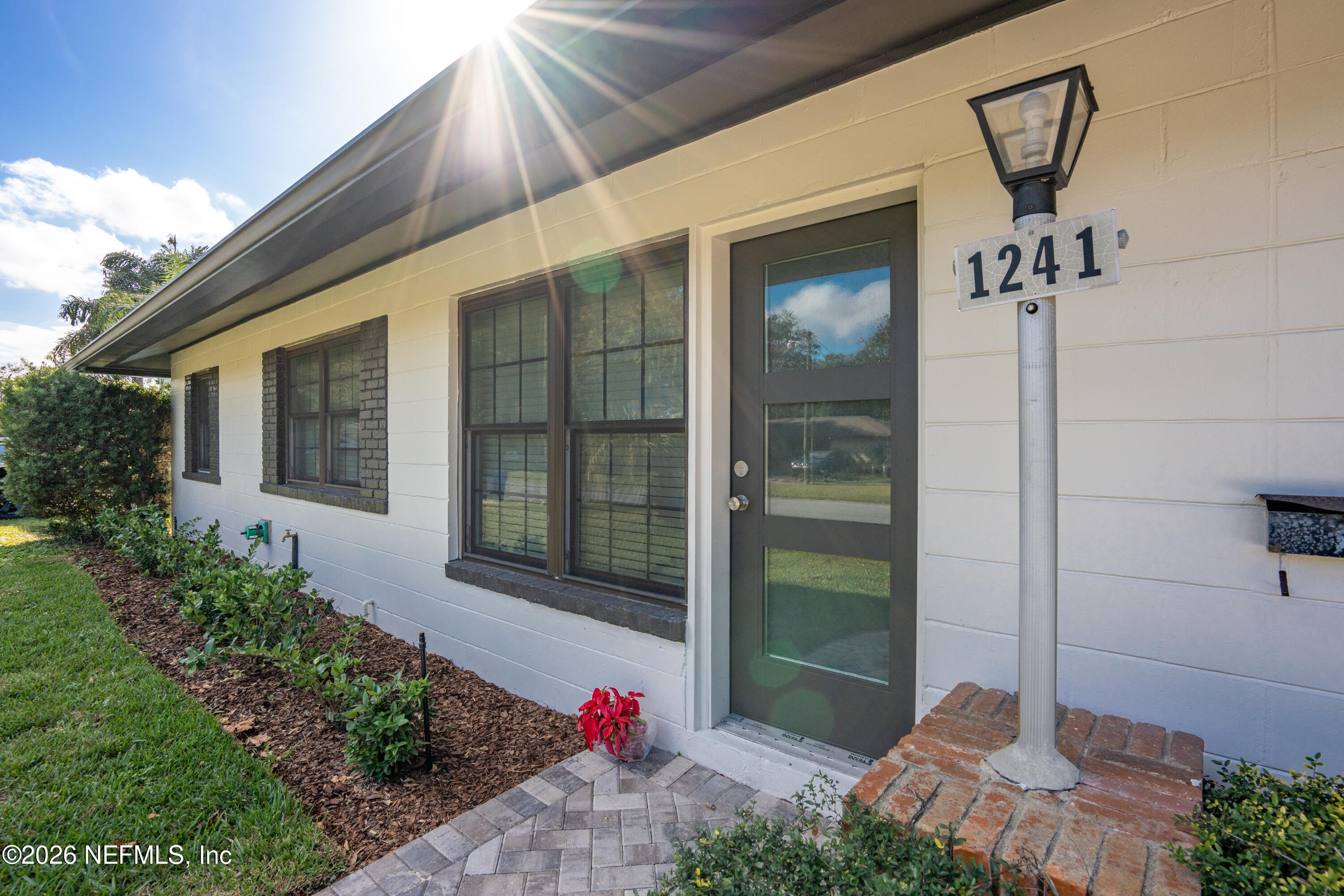 1241 Hibiscus Street St. Augustine, FL 32084 - Photo 3 of 27 a front view of a house with a yard