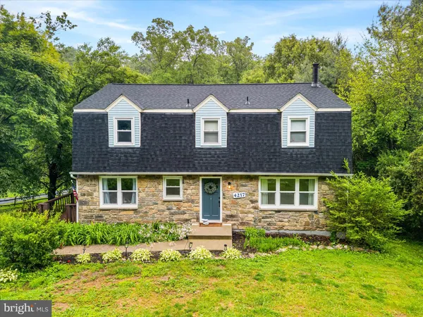 a aerial view of a house with a yard