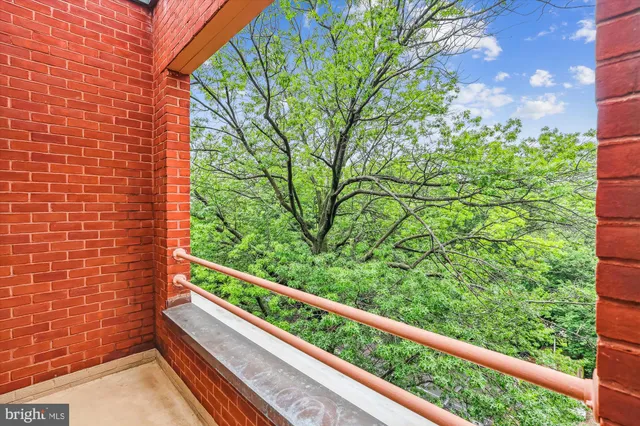 a view of a balcony with a tree