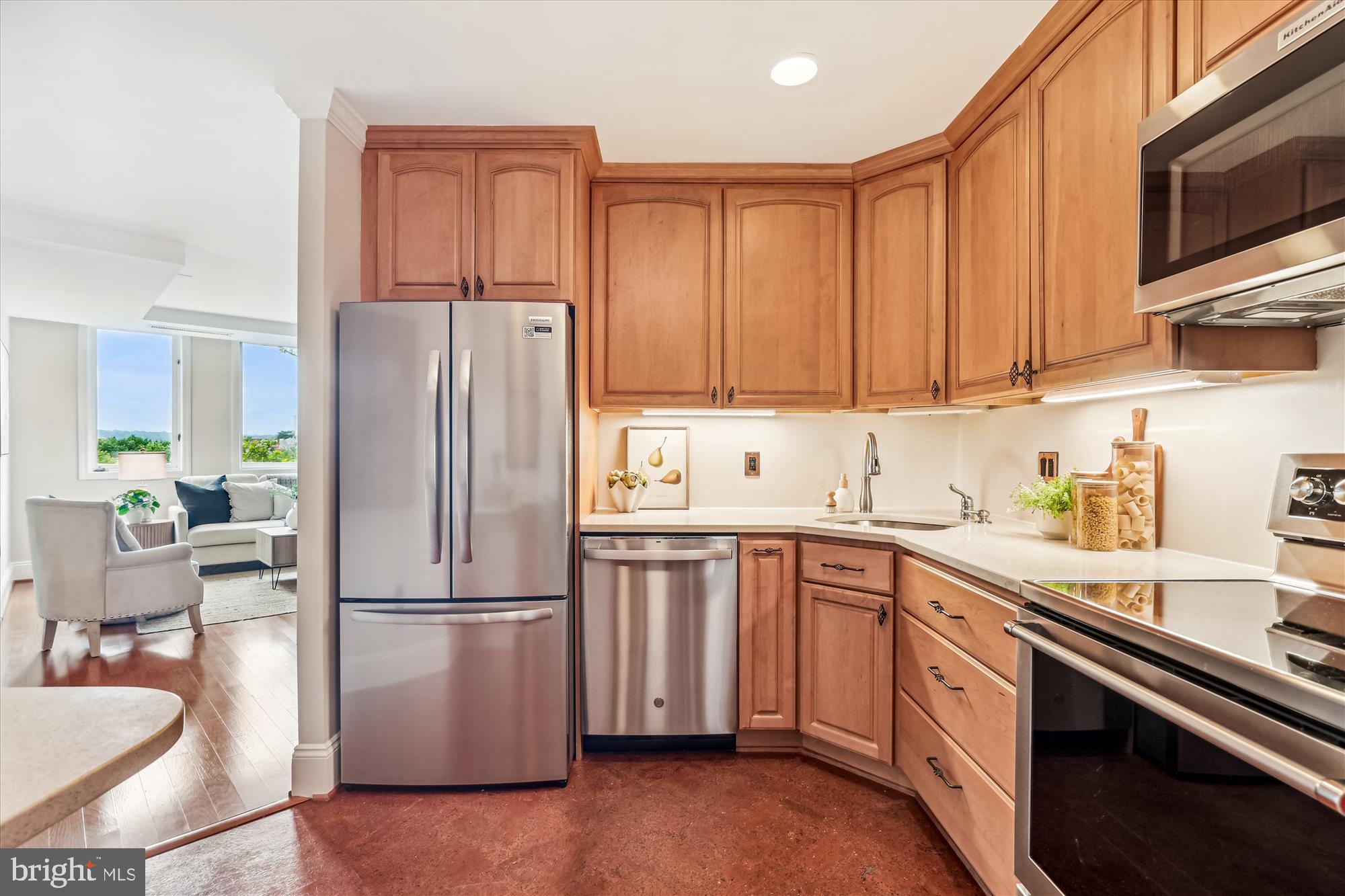 955 26th Street Northwest, Unit 512 Washington, DC 20037 - Photo 13 of 41 a kitchen with stainless steel appliances granite countertop a refrigerator sink and cabinets