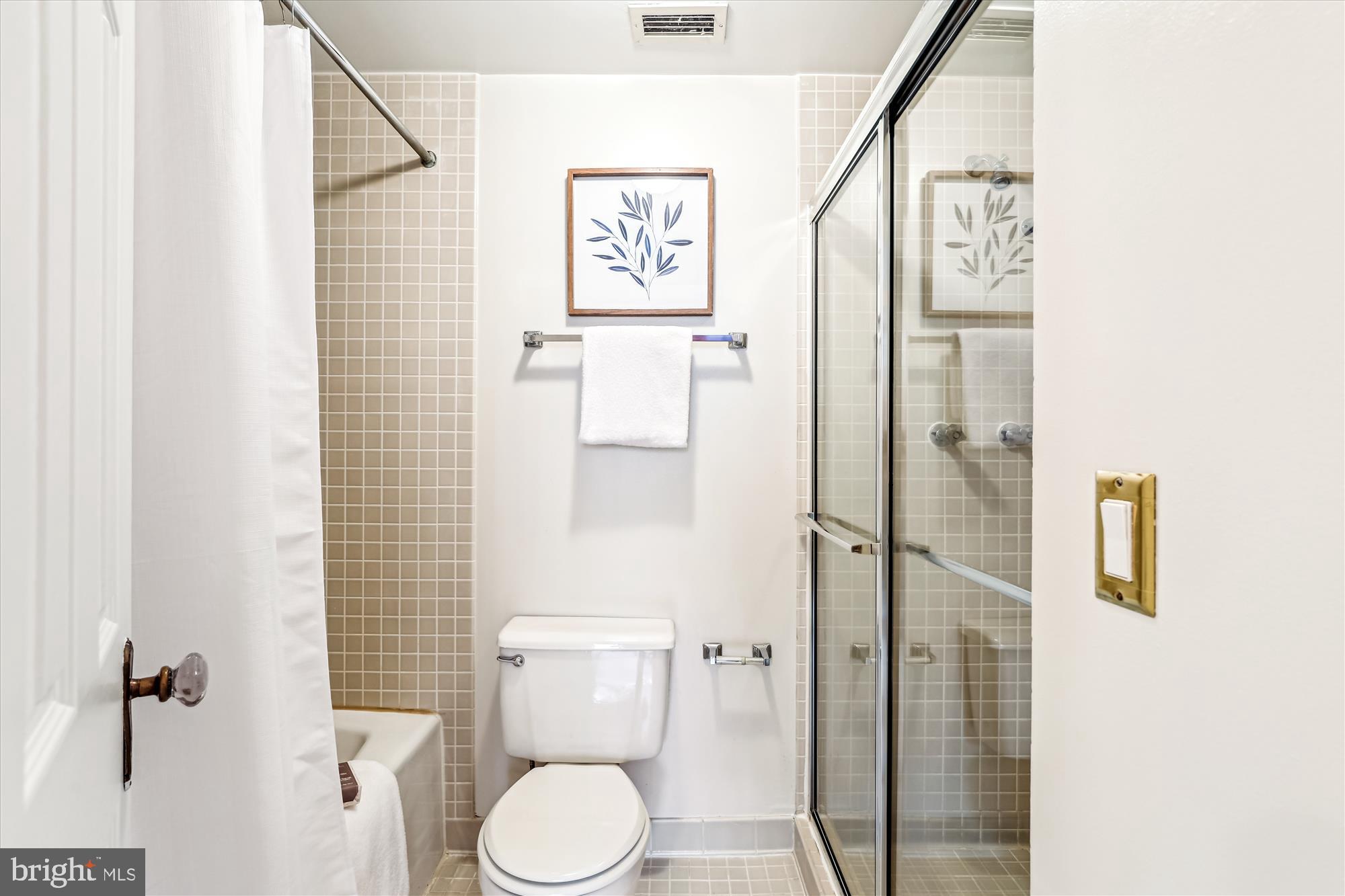955 26th Street Northwest, Unit 512 Washington, DC 20037 - Photo 19 of 41 a white toilet sitting next to a bathroom sink