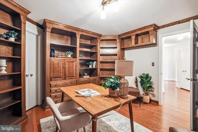 a workspace with furniture and book shelf