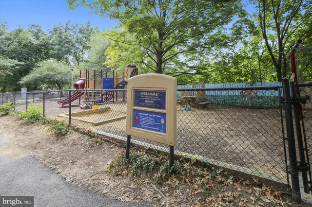 a view of a wooden fence next to a yard