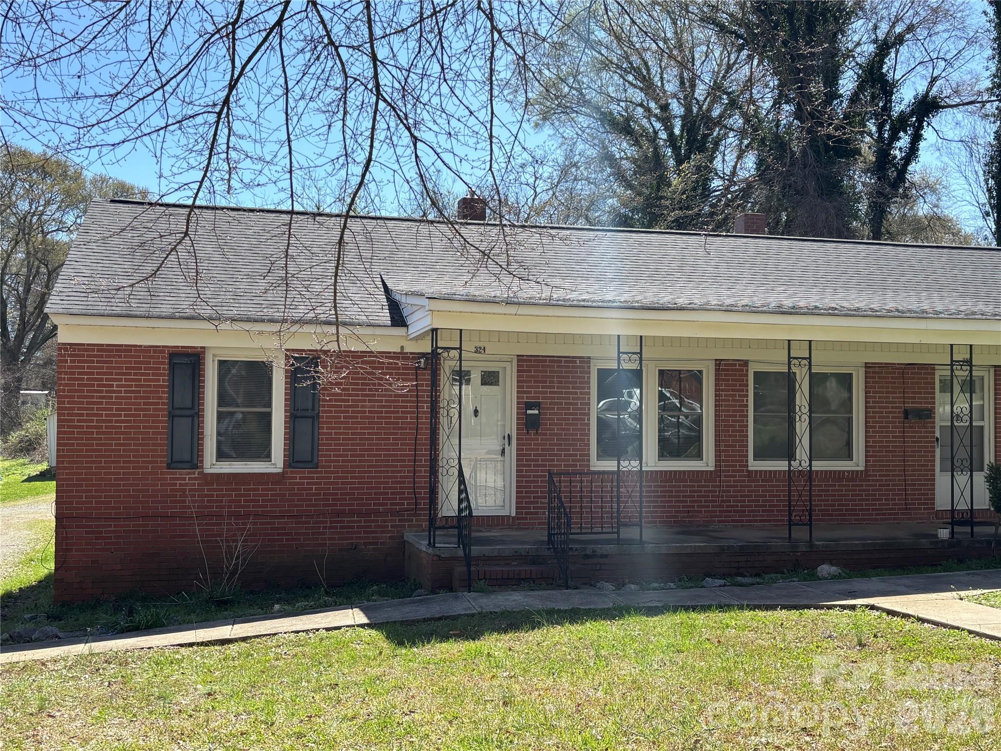 324 East Rhodes Street Lincolnton, NC 28092 - Photo 1 of 10 a view of a house with a yard