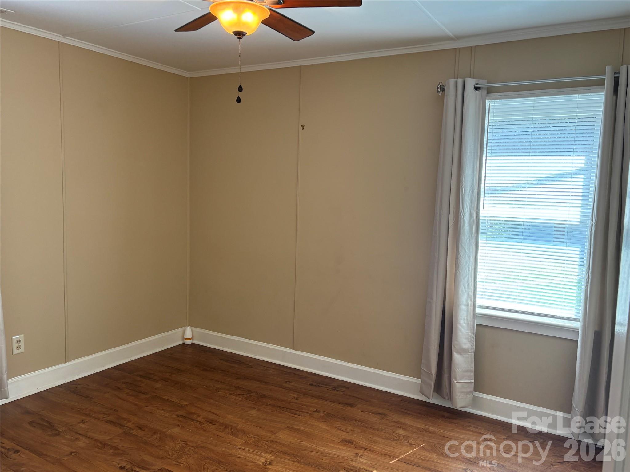 324 East Rhodes Street Lincolnton, NC 28092 - Photo 7 of 10 a view of an empty room and window