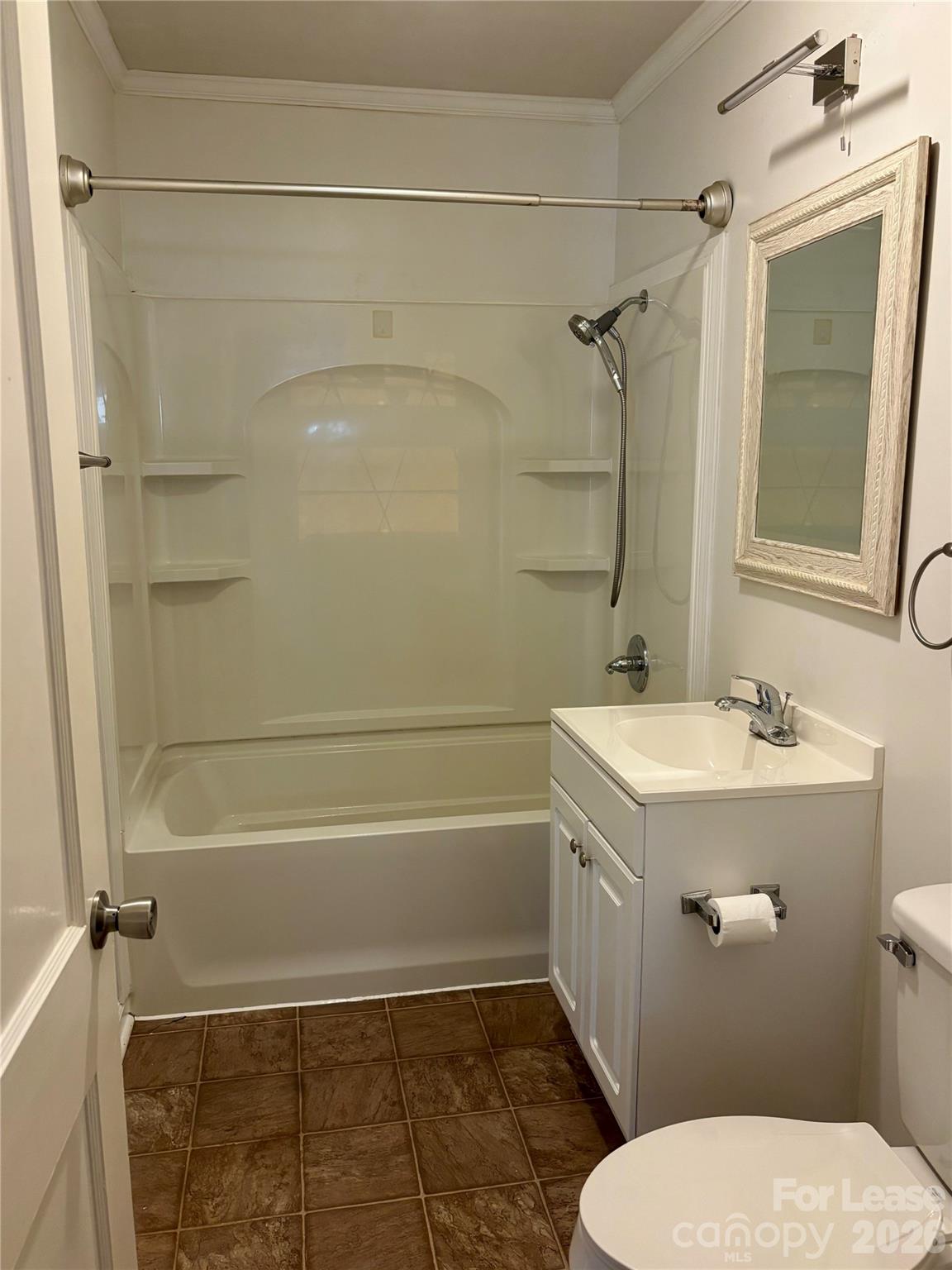 324 East Rhodes Street Lincolnton, NC 28092 - Photo 9 of 10 a bathroom with a sink a toilet and shower