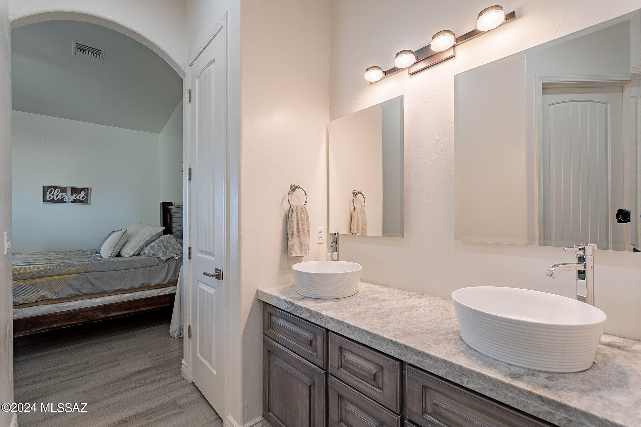 176 Avenida Ostion Rio Rico, AZ 85648 - Photo 26 of 48 a spacious bathroom with a double vanity sink and a mirror