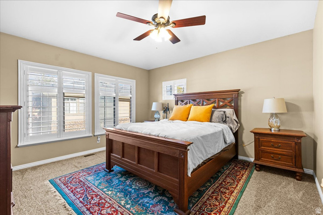 7824 South Sequoia Tree Lane Sandy, UT 84094 - Photo 19 of 43 Bedroom with light carpet and ceiling fan