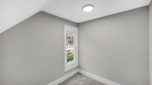 a front view of a house with a yard table and chairs