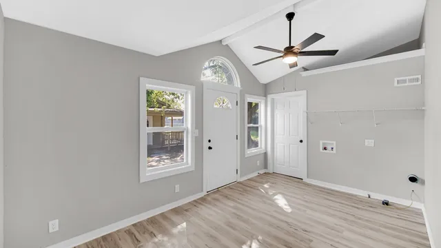 a view of entryway with wooden floor