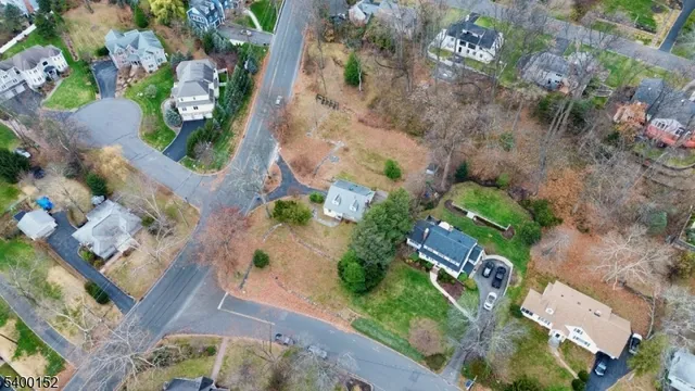 an aerial view of a house with yard