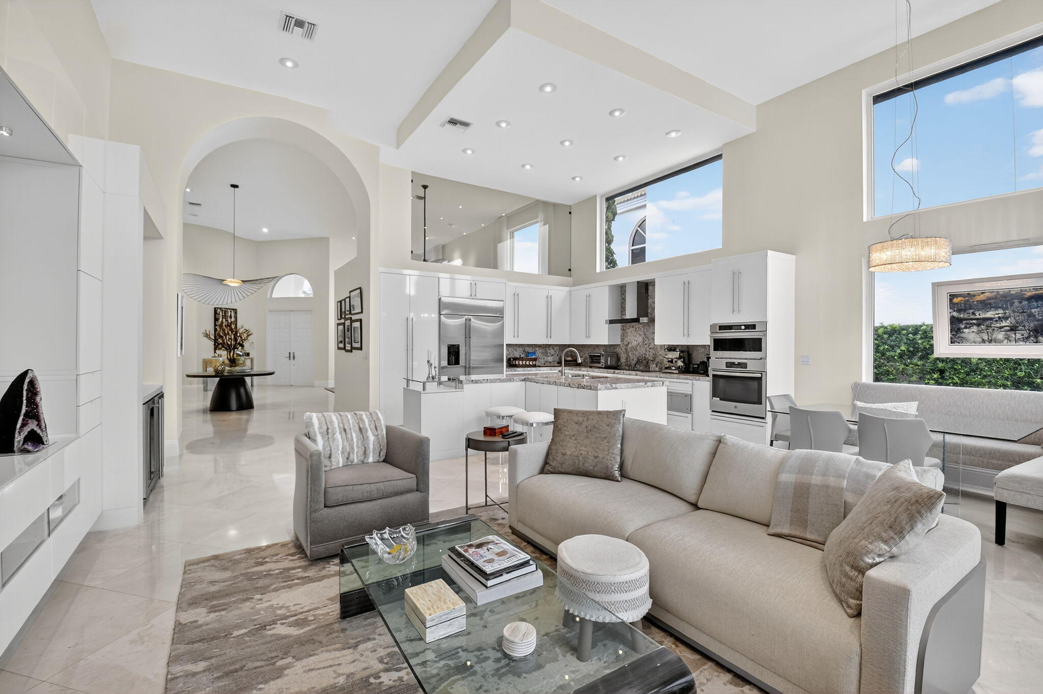 2563 Northwest 63rd Street Boca Raton, FL 33496 - Photo 20 of 65 a living room with furniture and a large window