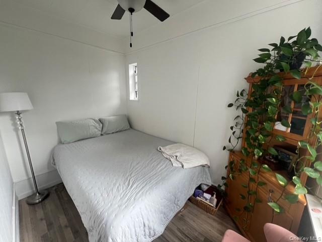 80 North 8th Street, Unit 2 Brooklyn, NY 11249 - Photo 3 of 8 a bedroom with a bed window and a chandelier