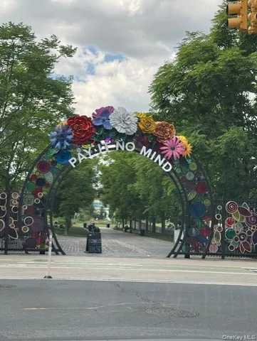 a tall building with trees in front of it