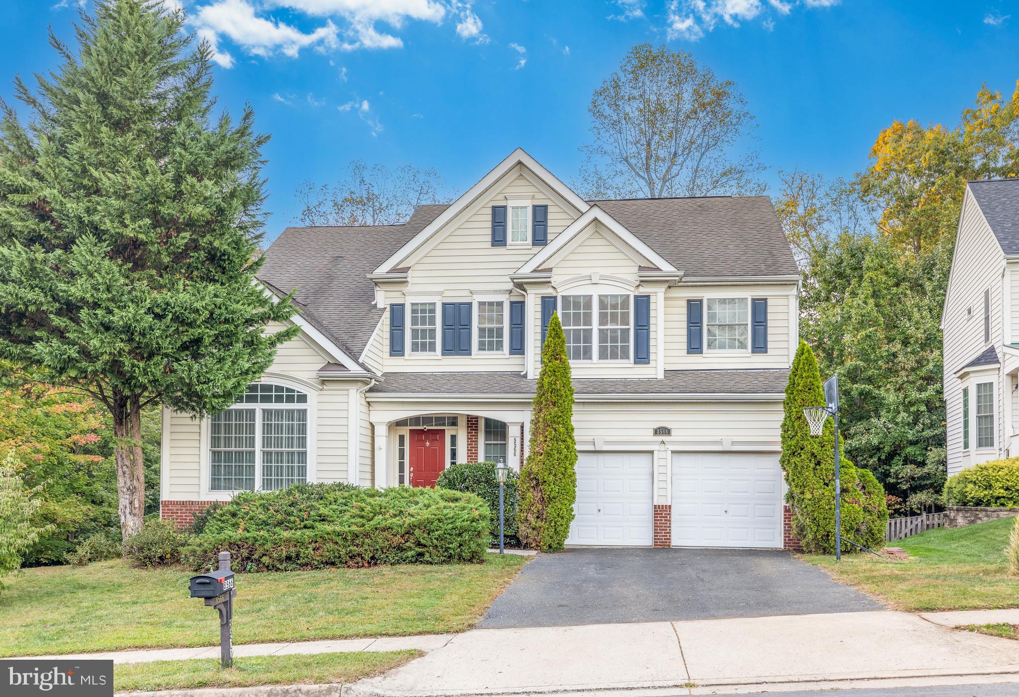 8566 Brickshire Lane Manassas, VA 20112 - Photo 2 of 59 a front view of a house with a yard