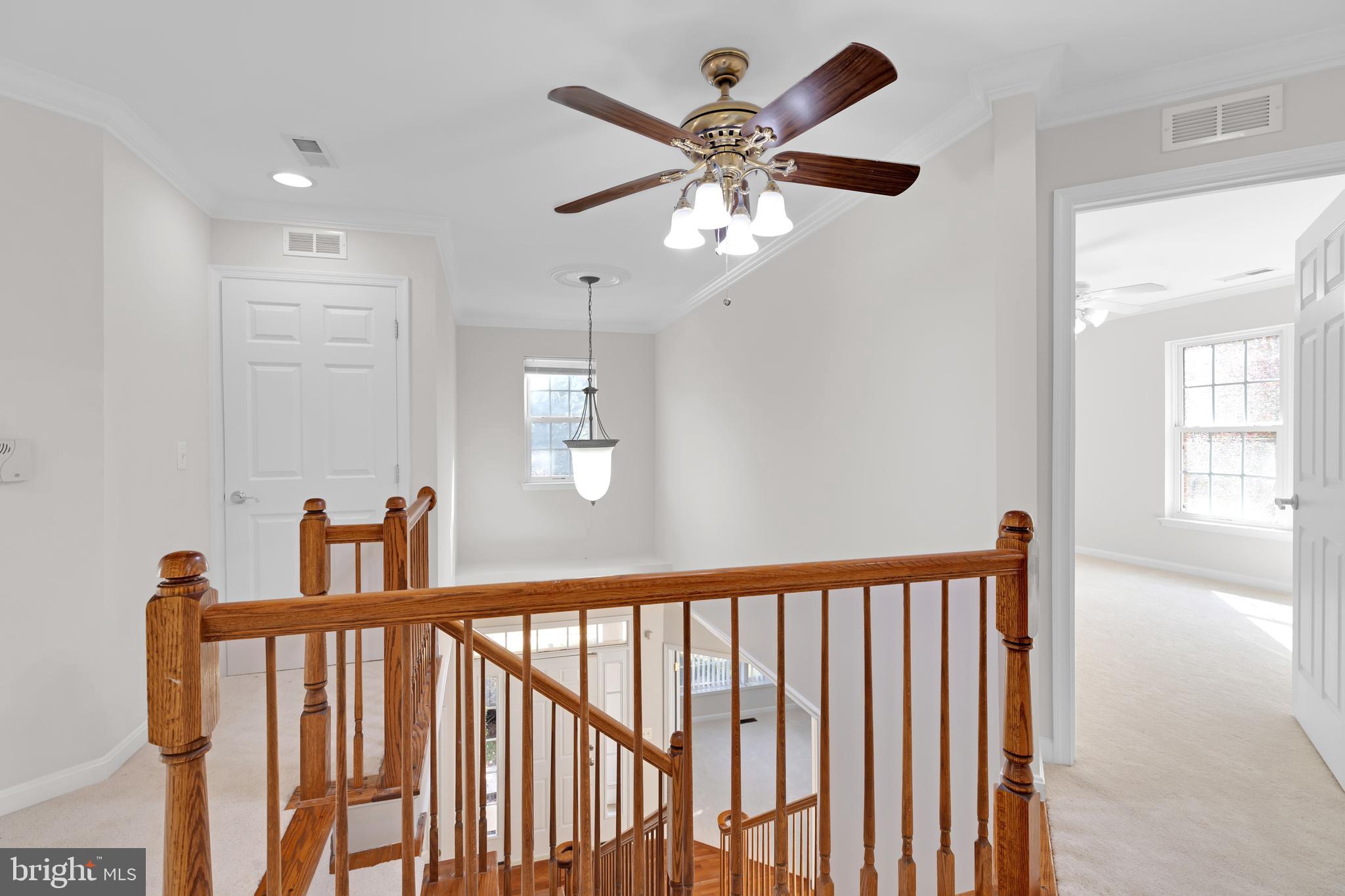 8566 Brickshire Lane Manassas, VA 20112 - Photo 23 of 59 a view of a hallway with windows