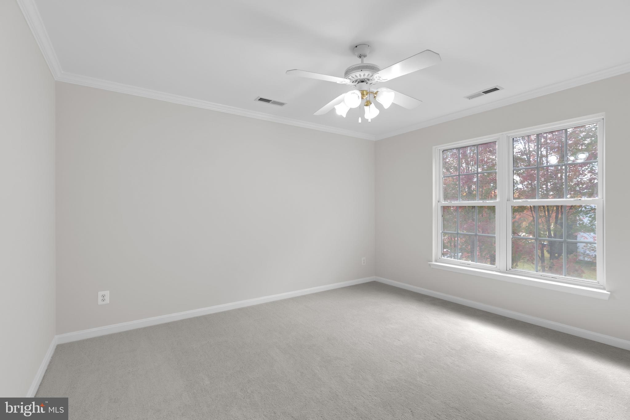 8566 Brickshire Lane Manassas, VA 20112 - Photo 32 of 59 an empty room with a window