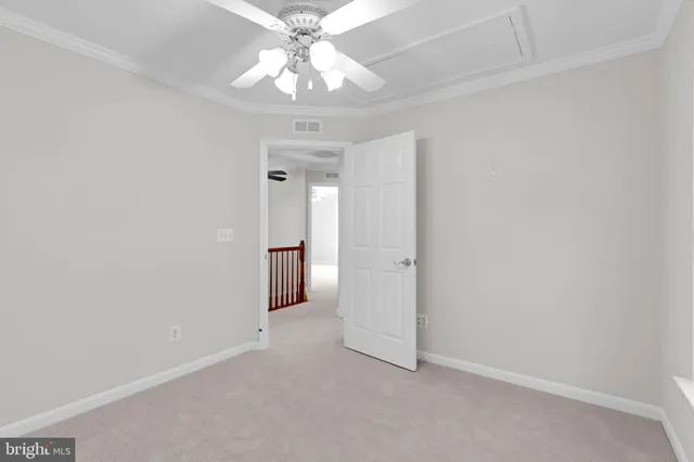a bathroom with a double vanity sink mirror and toilet