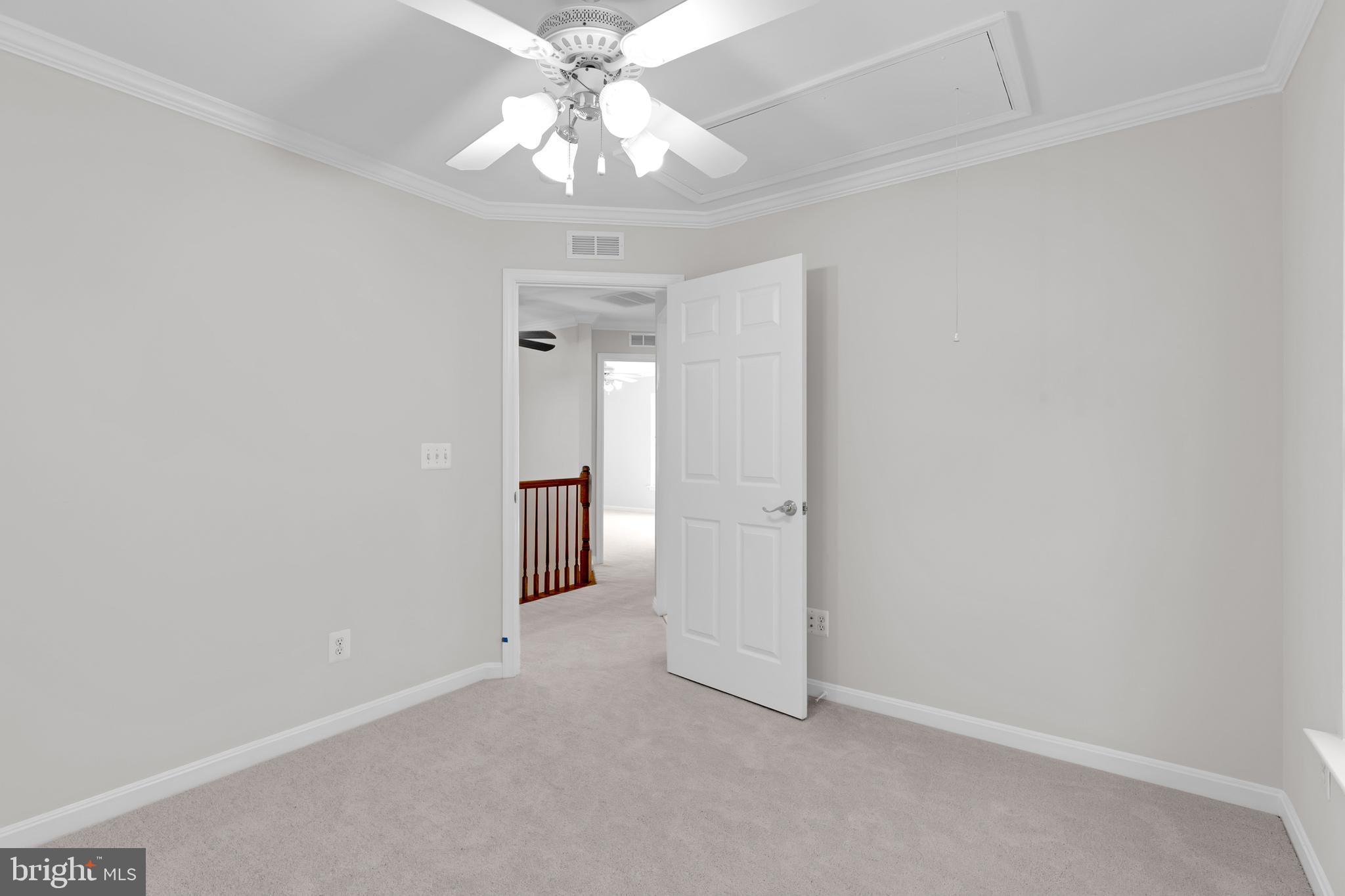 8566 Brickshire Lane Manassas, VA 20112 - Photo 33 of 59 an empty room with a chandelier fan and closet area