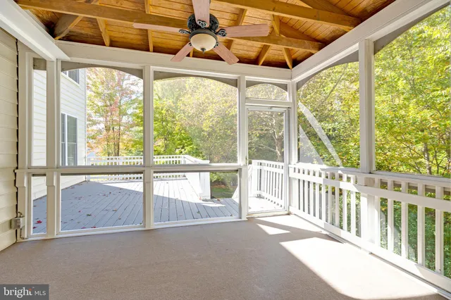 an aerial view of residential house with outdoor space and swimming pool