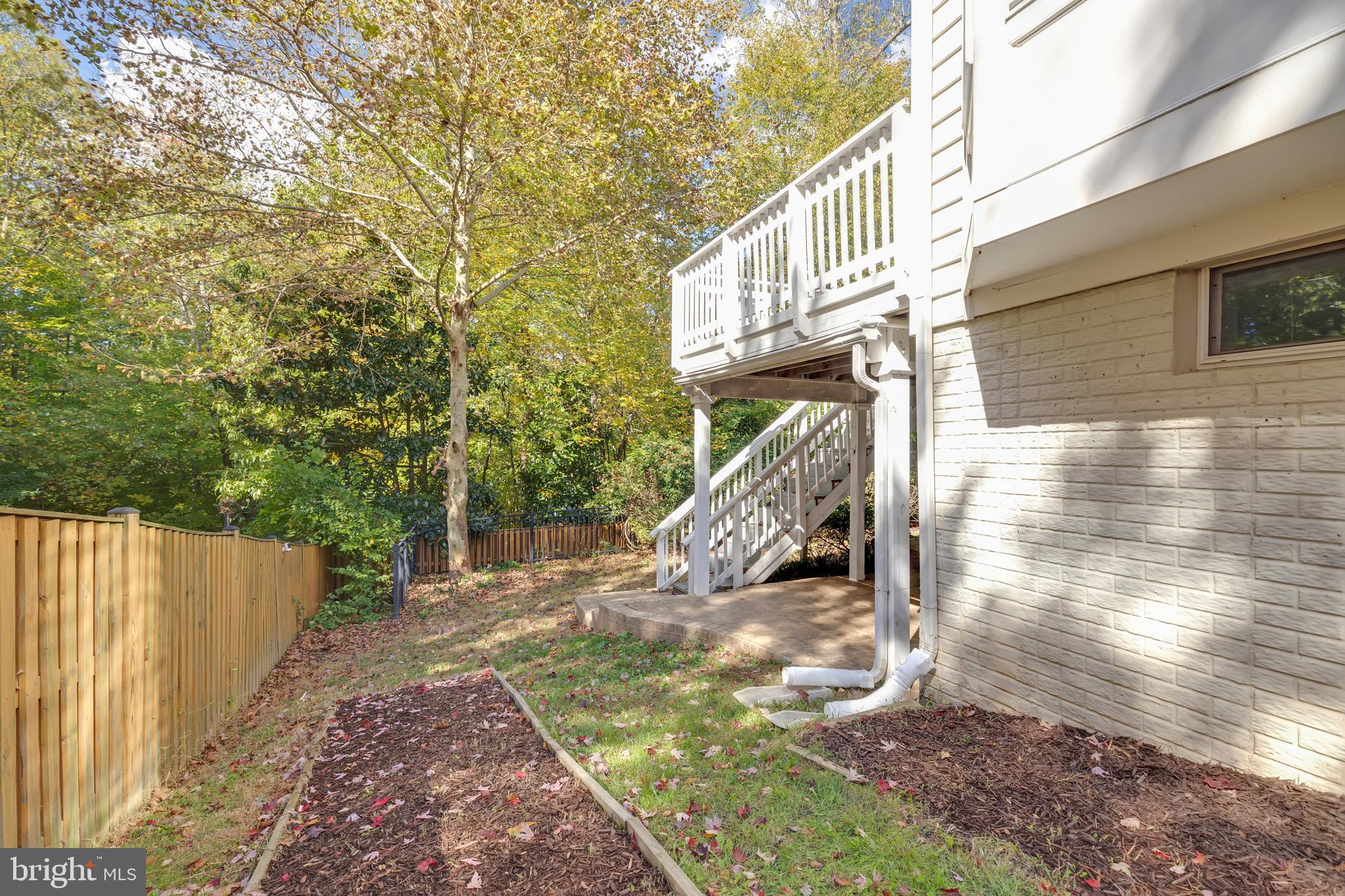 8566 Brickshire Lane Manassas, VA 20112 - Photo 53 of 59 a view of a deck with a trees