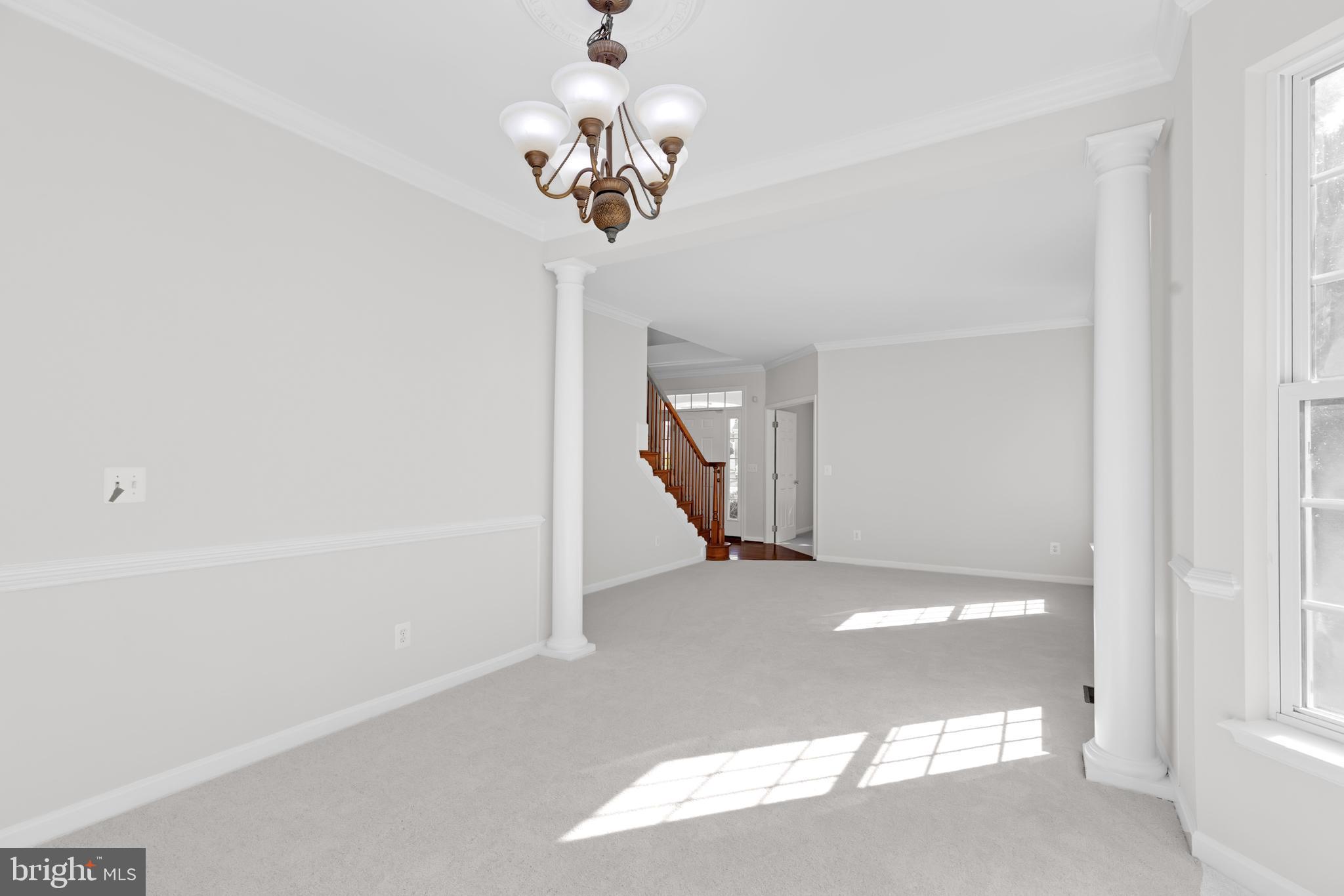 8566 Brickshire Lane Manassas, VA 20112 - Photo 6 of 59 a view of a livingroom with a chandelier
