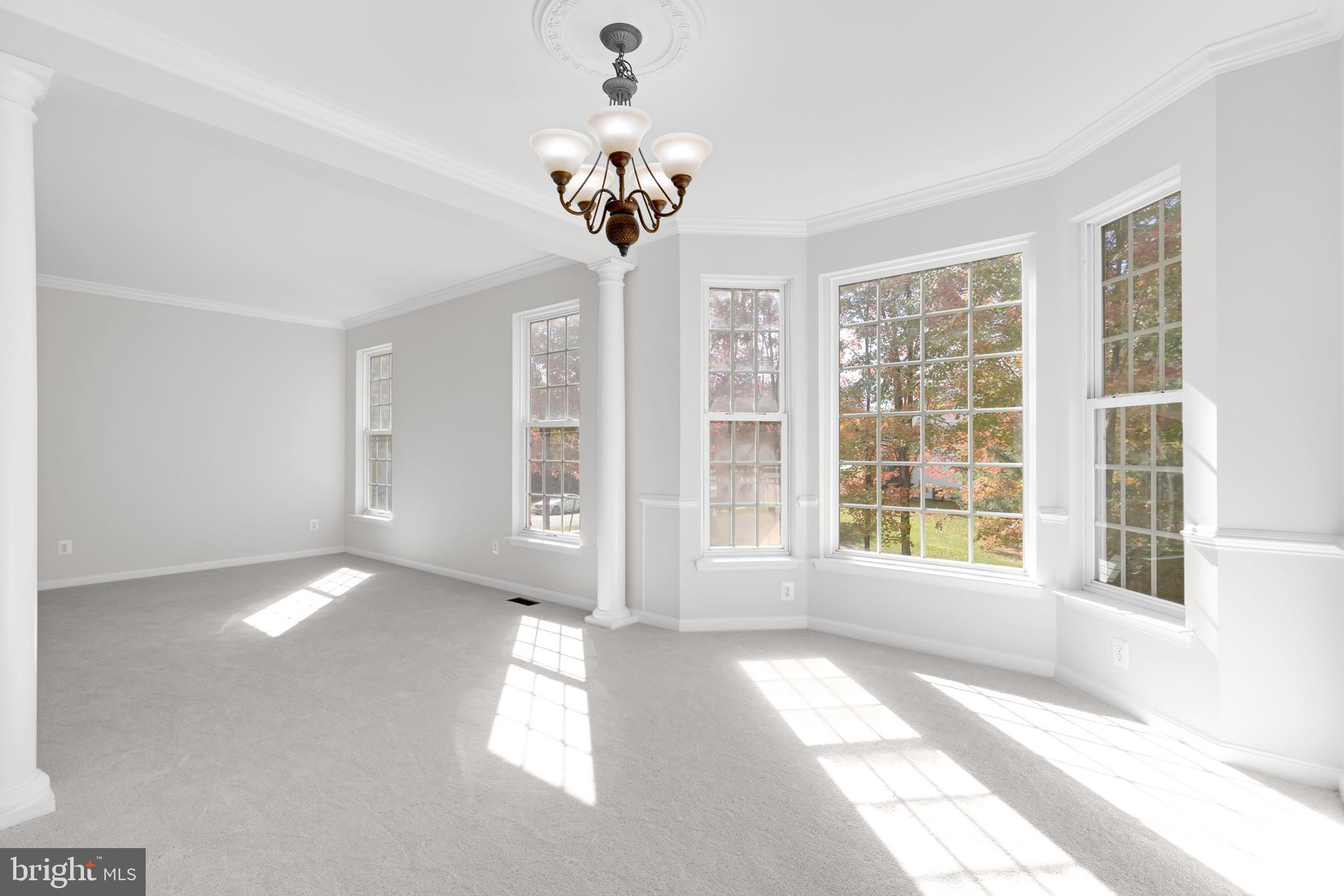 8566 Brickshire Lane Manassas, VA 20112 - Photo 7 of 59 a view of an empty room with a window
