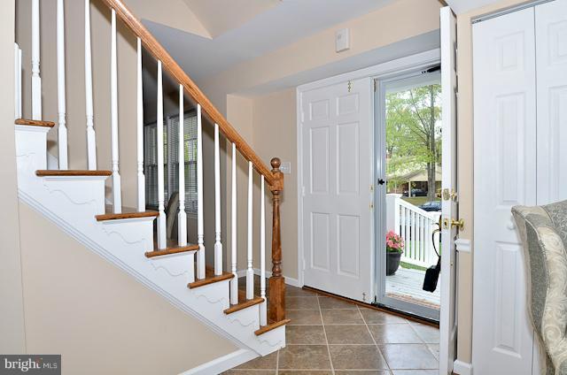 6902 Huntsman Boulevard Springfield, VA 22153 - Photo 1 of 27 a view of an entryway with wooden floor and door