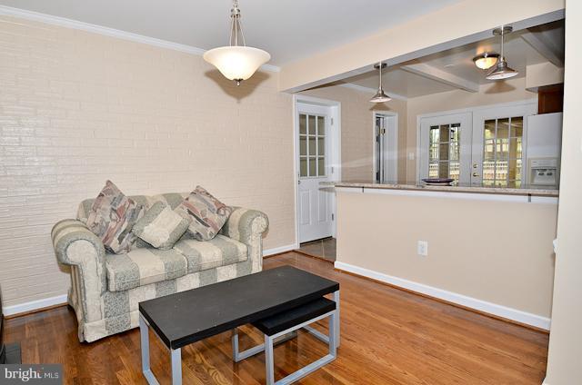 6902 Huntsman Boulevard Springfield, VA 22153 - Photo 11 of 27 a living room with furniture and wooden floor