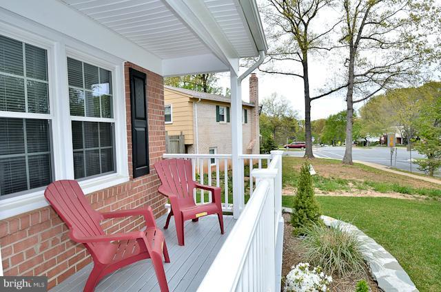 6902 Huntsman Boulevard Springfield, VA 22153 - Photo 17 of 27 a balcony with table and chairs