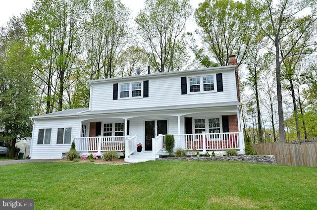 6902 Huntsman Boulevard Springfield, VA 22153 - Photo 27 of 27 front view of a house with a yard