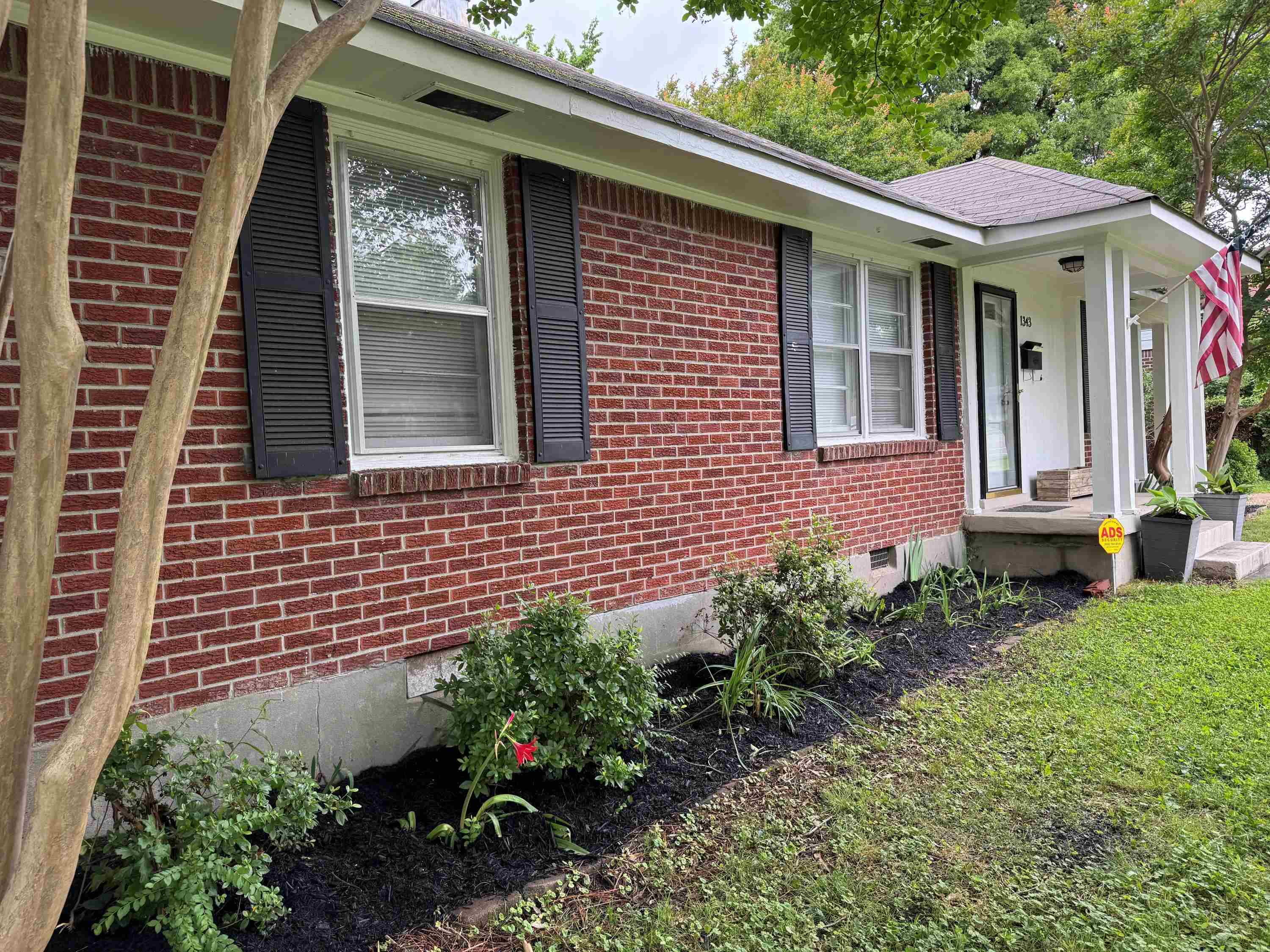 1343 Colonial Road Memphis, TN 38117 - Photo 29 of 33 a front view of a house with a yard