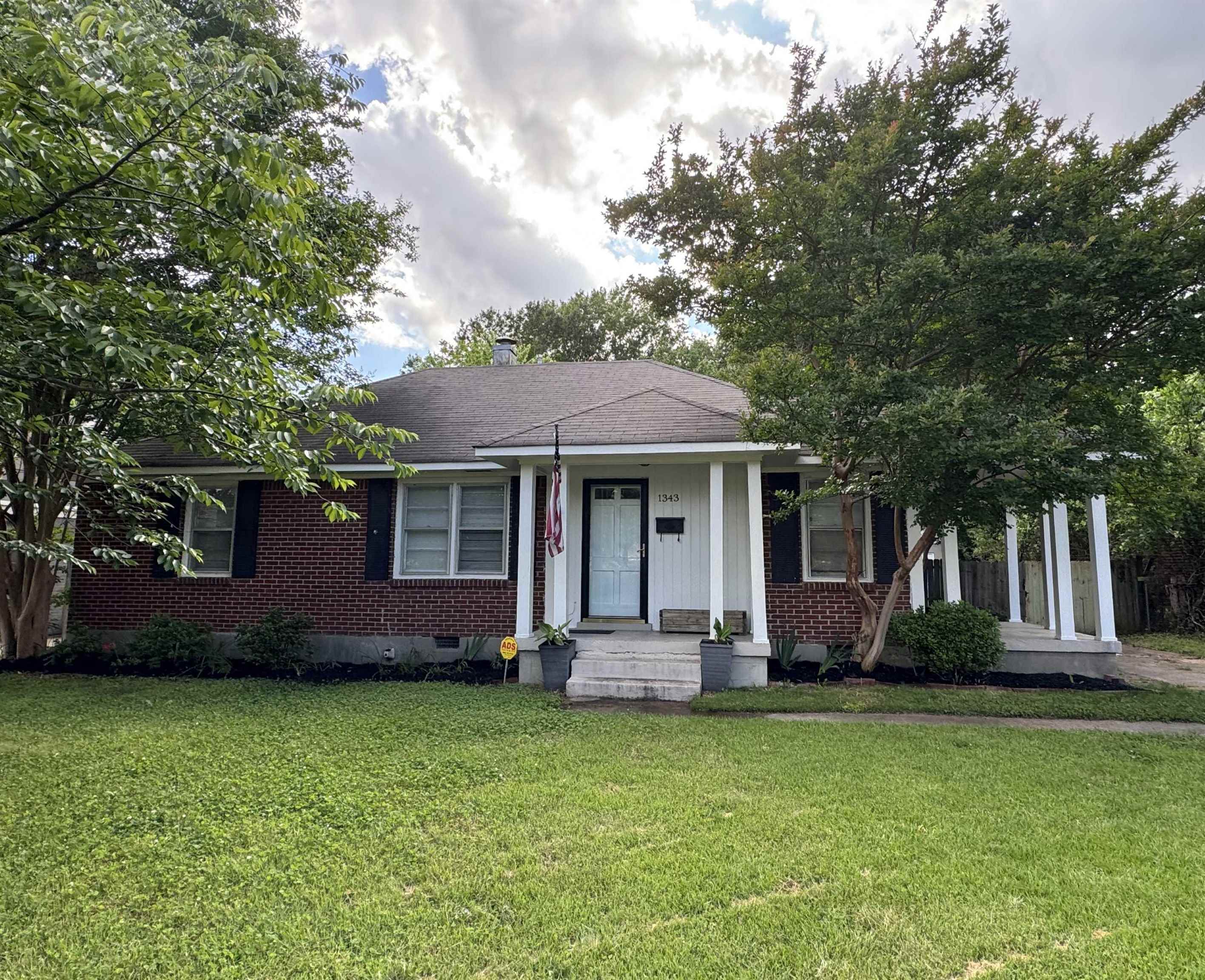 1343 Colonial Road Memphis, TN 38117 - Photo 30 of 33 a front view of a house with a garden
