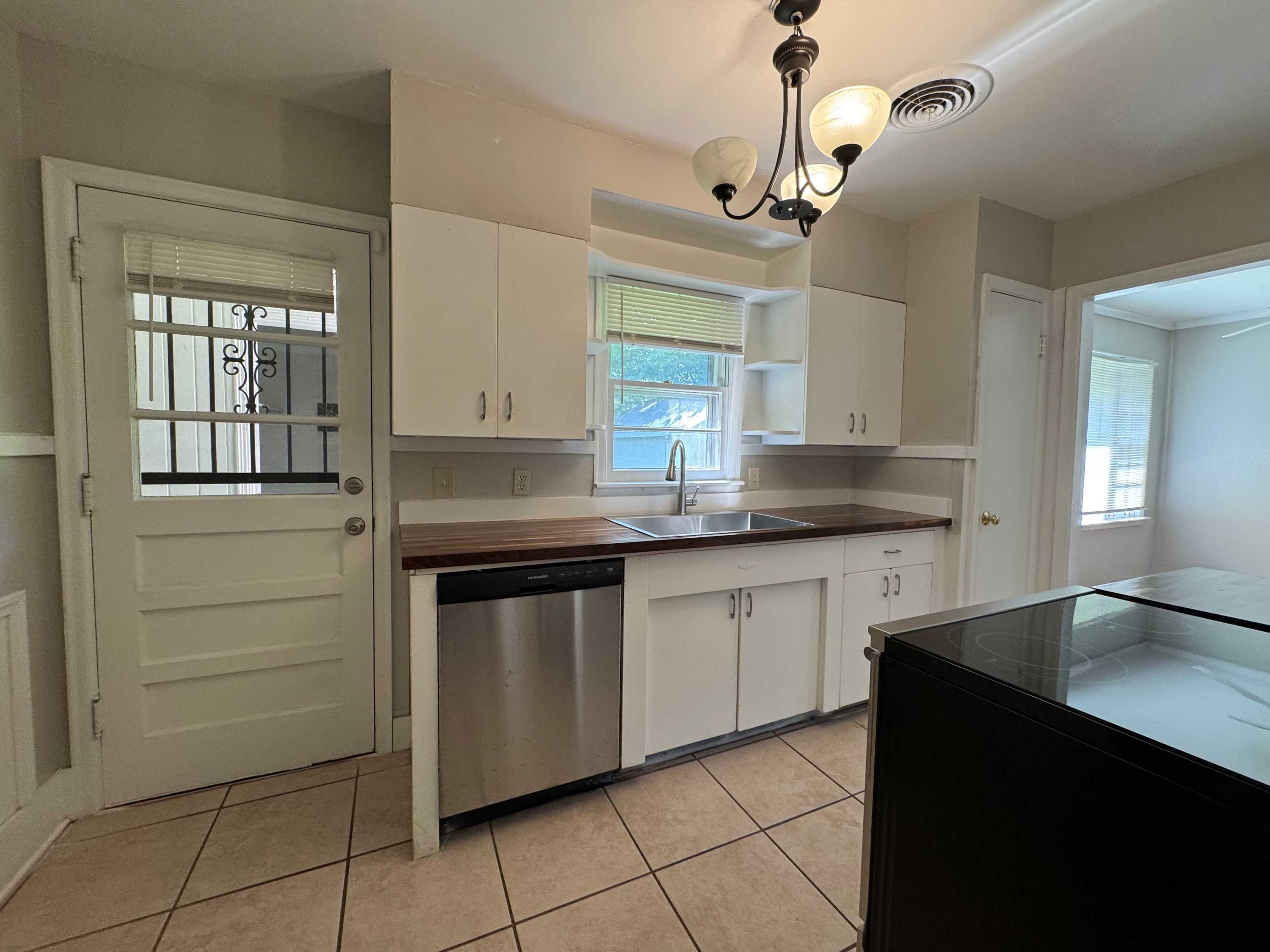 1343 Colonial Road Memphis, TN 38117 - Photo 9 of 33 a kitchen with granite countertop cabinets and window