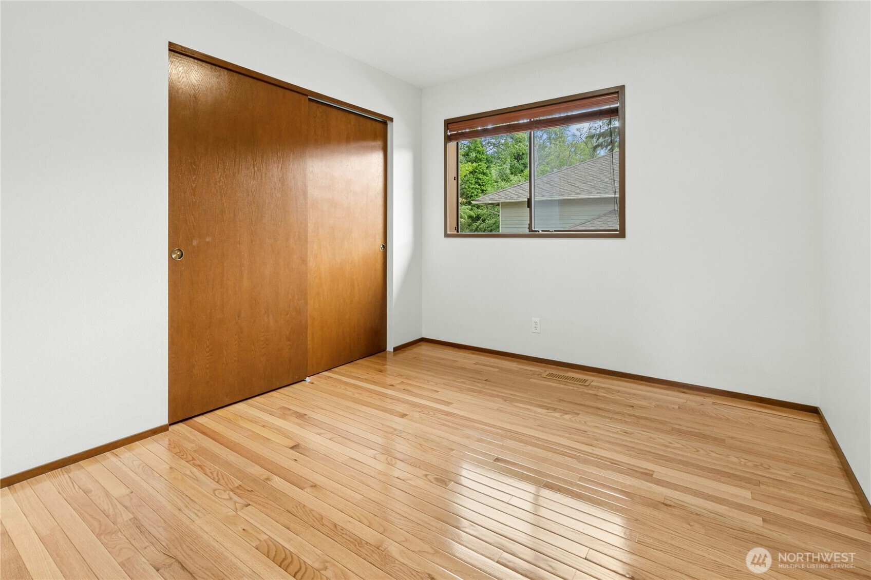 5211 103rd Street Southwest, Unit SW Mukilteo, WA 98275 - Photo 26 of 40 a view of empty room with wooden floor and fan