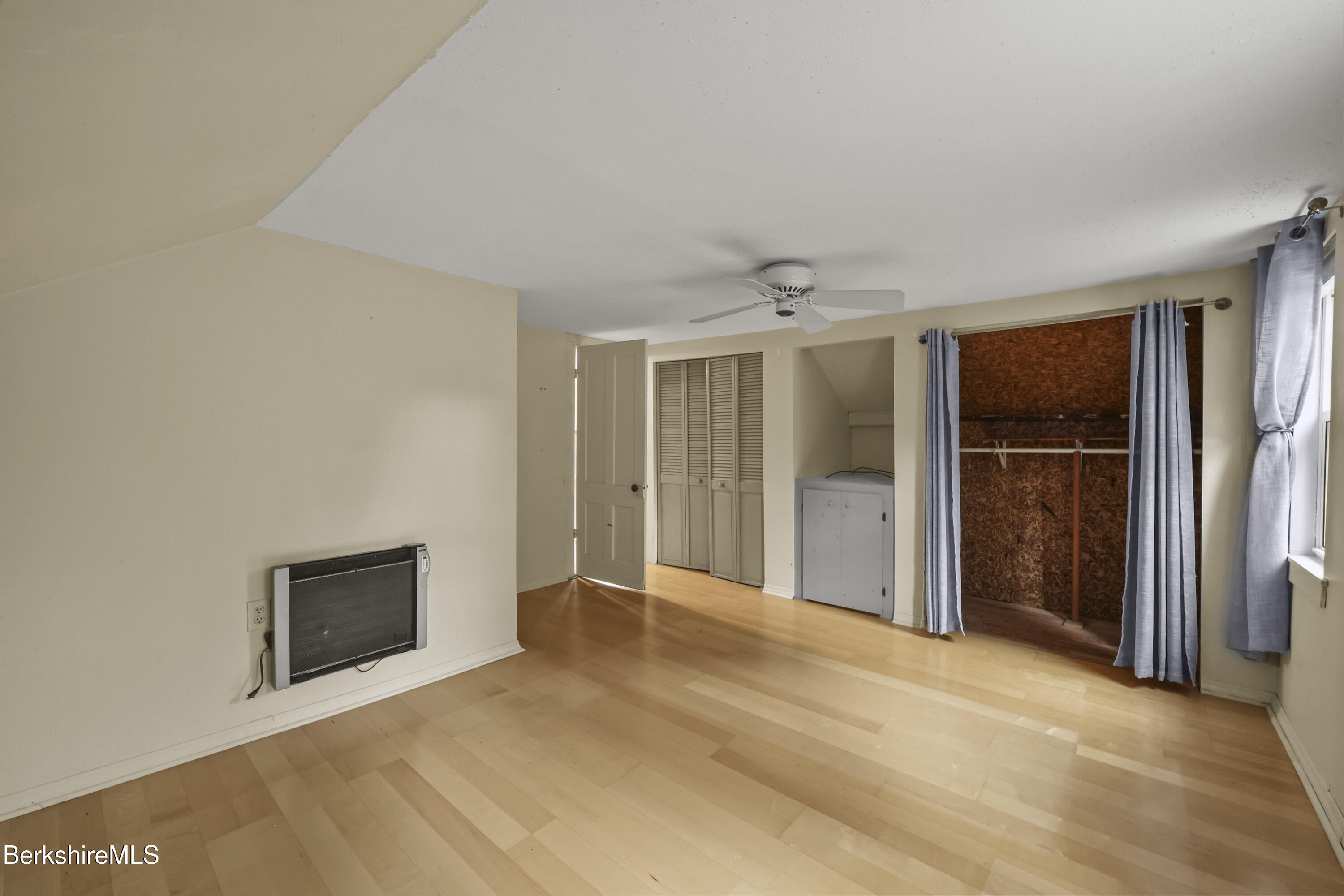 2801 State Road Richmond, MA 01254 - Photo 29 of 46 a view of an empty room with a fireplace and a window