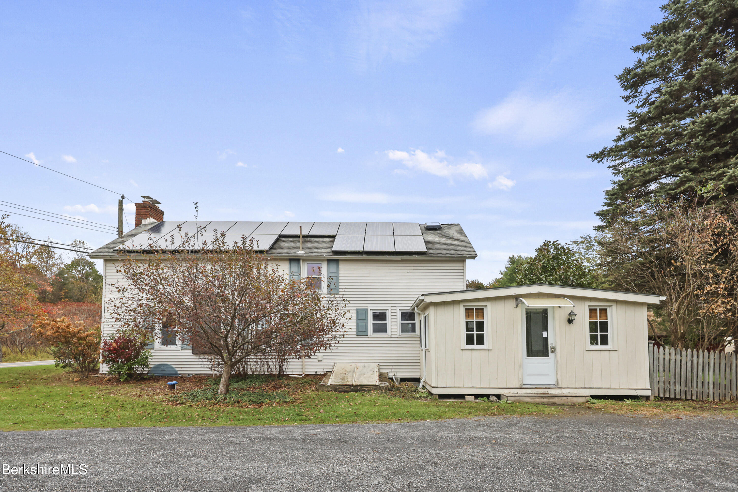2801 State Road Richmond, MA 01254 - Photo 5 of 46 a white house with a tree in front of it
