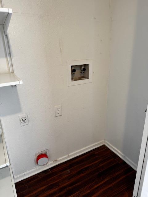 Laundry area on main level with washer hookup, dark wood-type flooring, and hookup for an electric dryer
