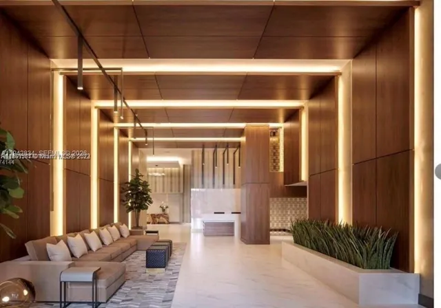 a living room with furniture and a potted plant