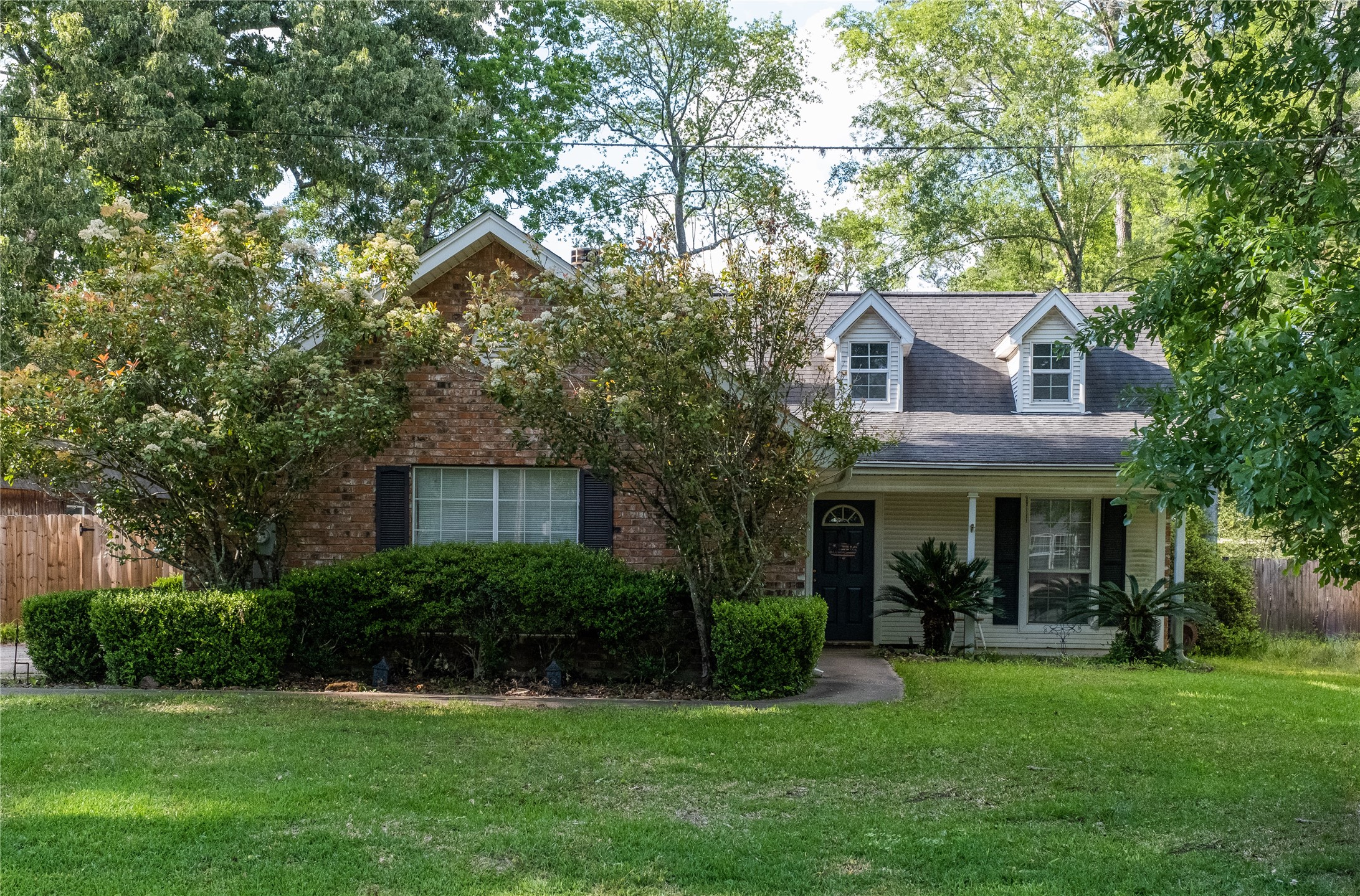 269 East Chance Cutoff Lumberton, TX 77657 - Photo 1 of 24 a front view of a house with a yard and trees