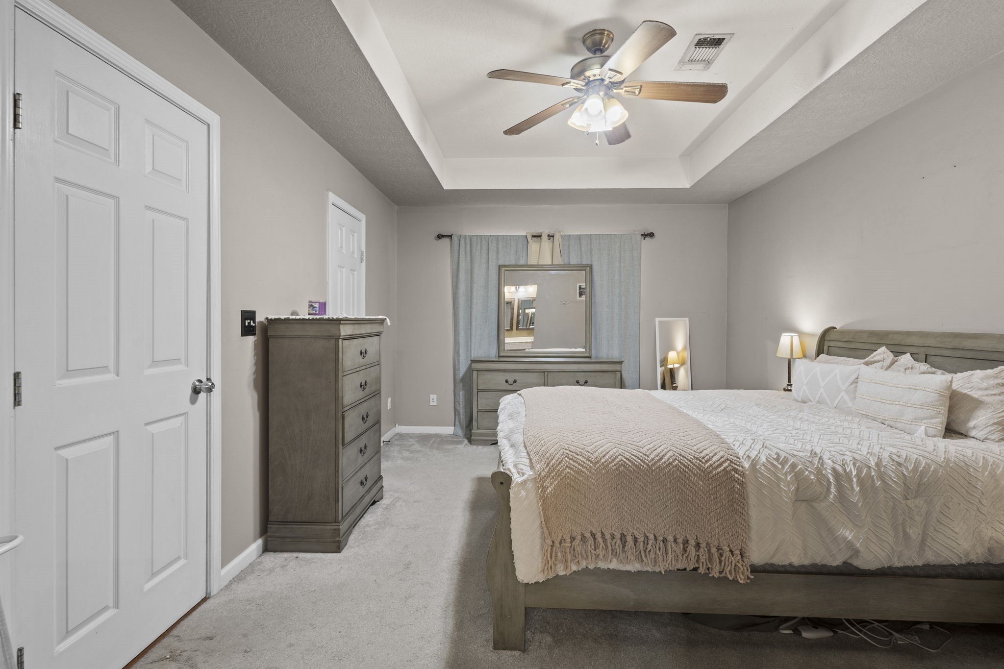 269 East Chance Cutoff Lumberton, TX 77657 - Photo 16 of 24 a bedroom with a bed and a chandelier