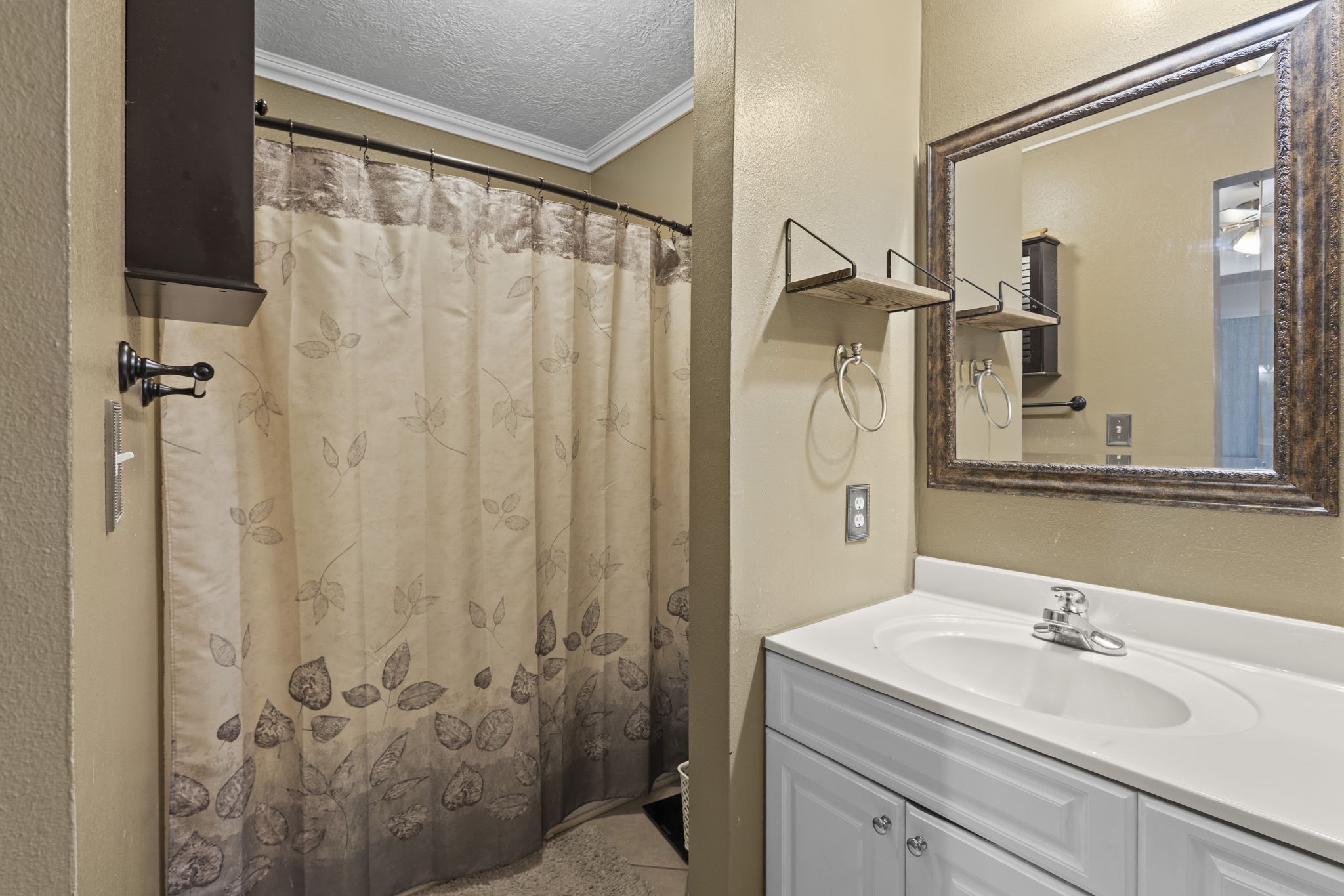 269 East Chance Cutoff Lumberton, TX 77657 - Photo 18 of 24 a bathroom with a granite countertop sink toilet and shower
