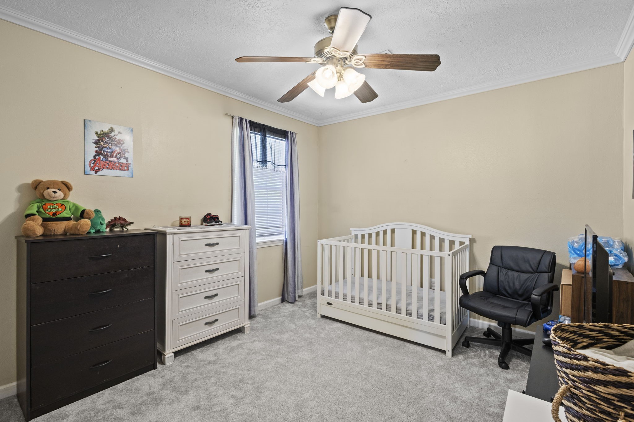 269 East Chance Cutoff Lumberton, TX 77657 - Photo 22 of 24 a bedroom with a bed and a chandelier