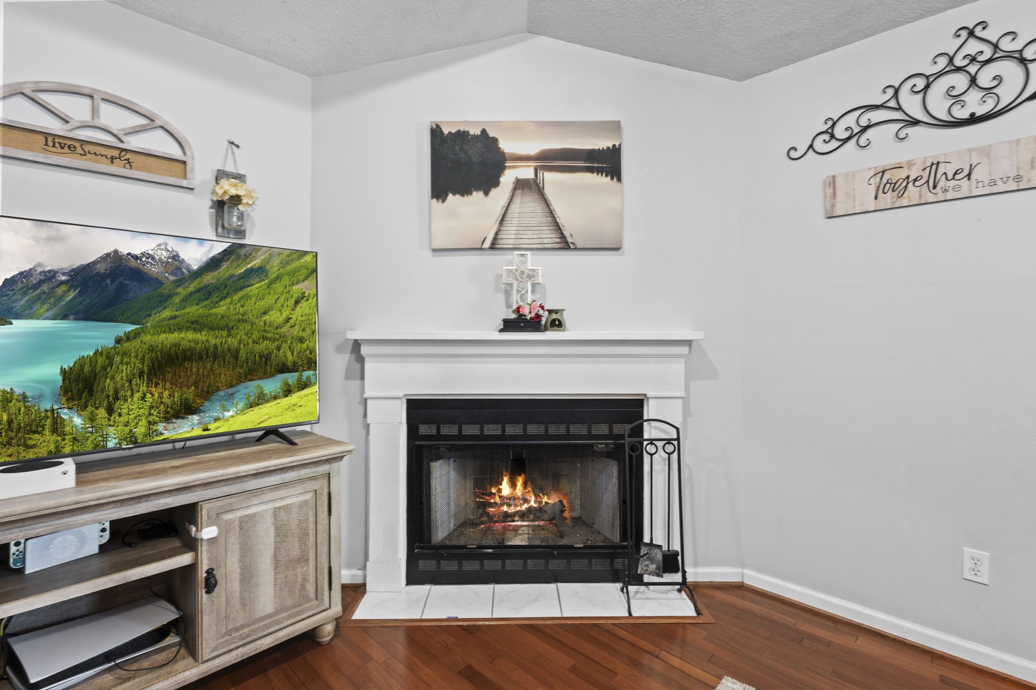 269 East Chance Cutoff Lumberton, TX 77657 - Photo 5 of 24 a living room with a fireplace and a wooden floor