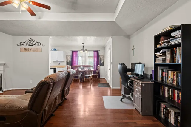 a view of a livingroom with workspace and a couch