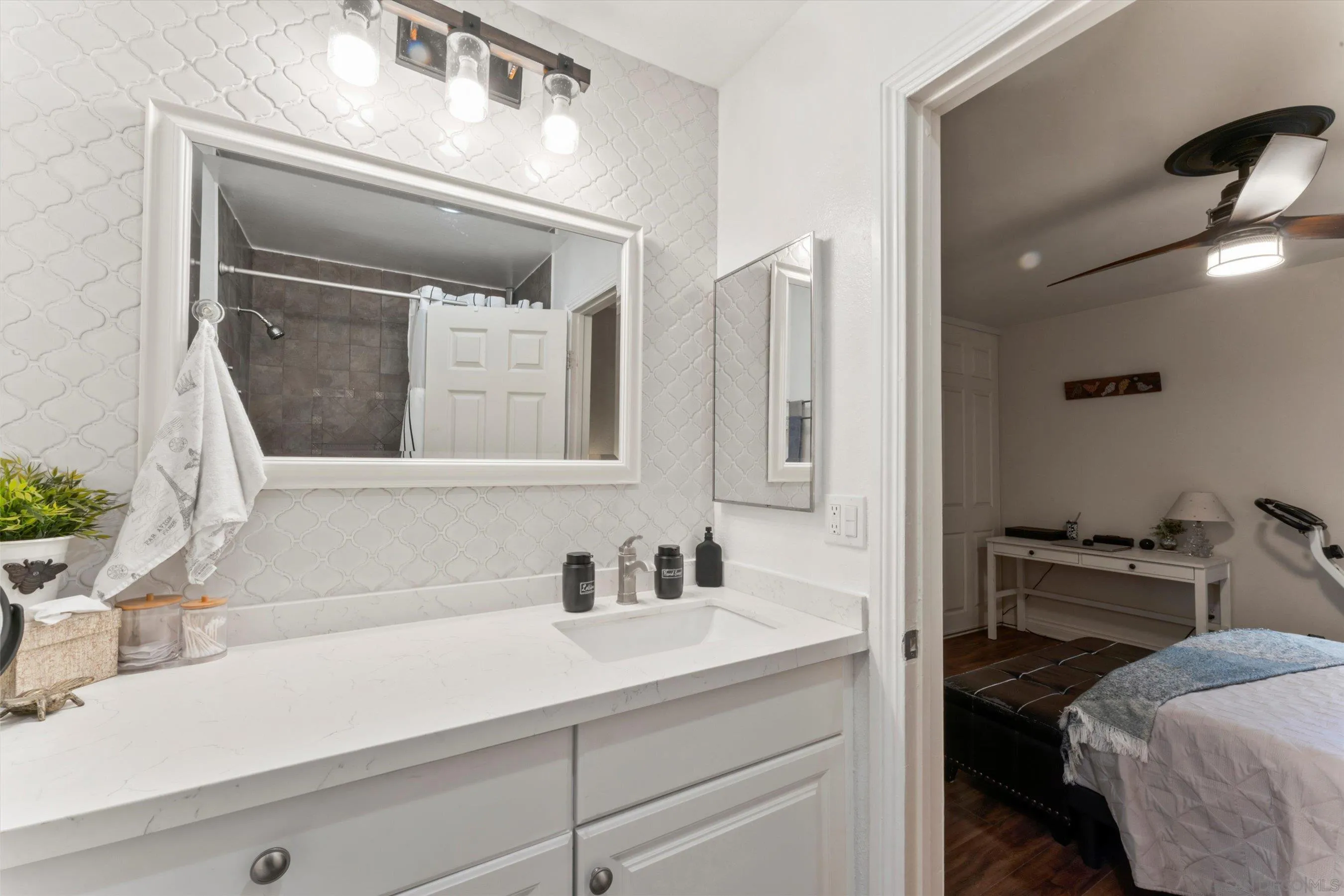 5483 Adobe Falls Road, Unit 7 San Diego, CA 92120 - Photo 16 of 20 a en suite bathroom with a sink and a mirror