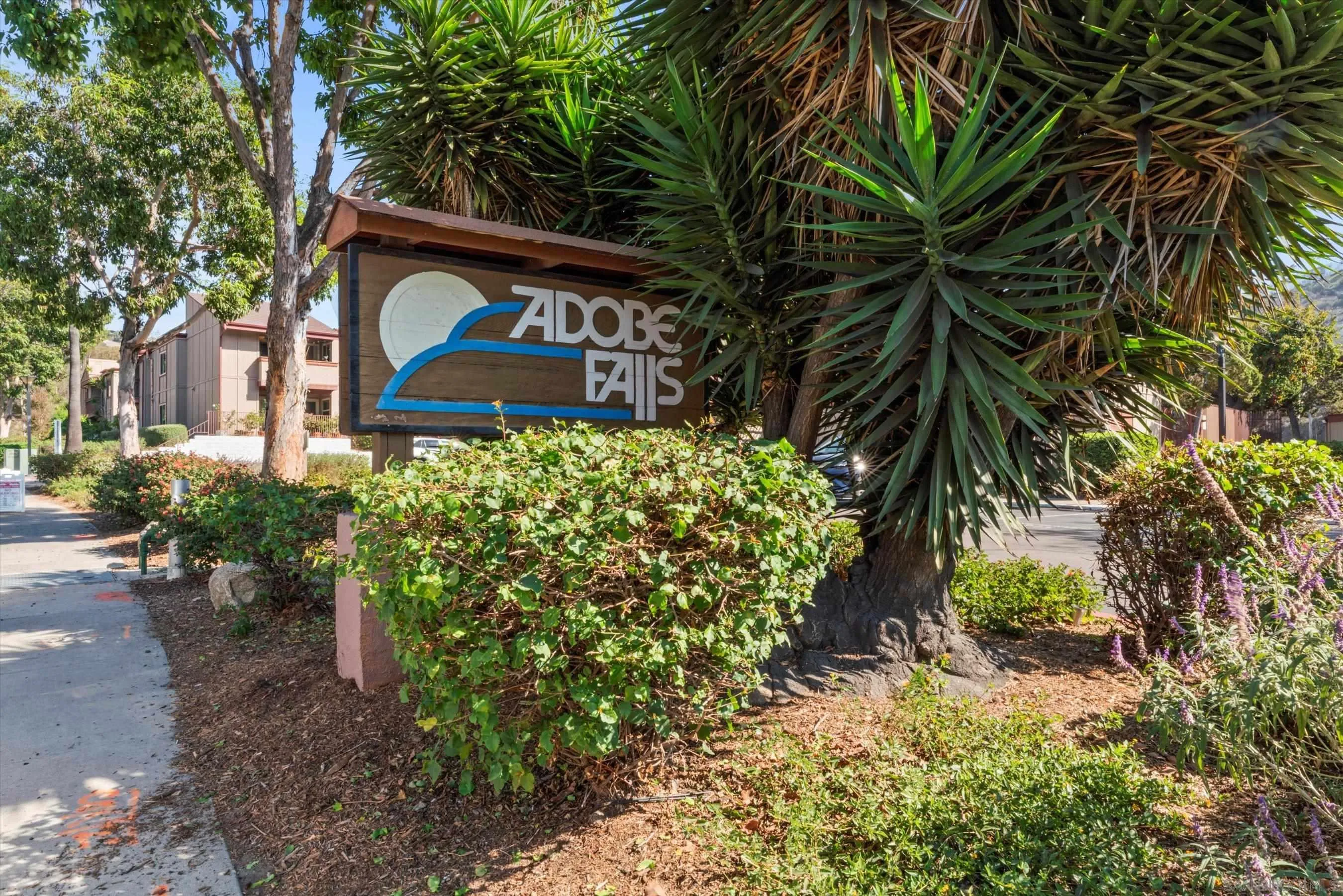 5483 Adobe Falls Road, Unit 7 San Diego, CA 92120 - Photo 2 of 20 a view of a garden with plants