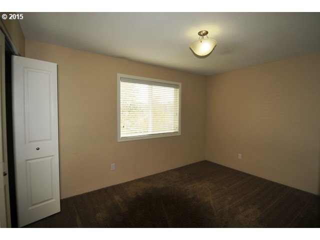 13320 Southwest Allen Boulevard, Unit 310 Beaverton, OR 97005 - Photo 12 of 18 a view of an empty room with window