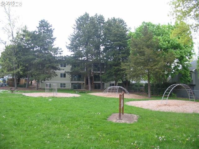 13320 Southwest Allen Boulevard, Unit 310 Beaverton, OR 97005 - Photo 17 of 18 a swimming pool with lots of trees